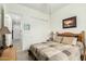 Bedroom with a neutral color palette, connecting to a hallway, and a large window at 9390 W Louise Dr, Peoria, AZ 85383