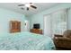 Bedroom featuring dark wood floors, a ceiling fan, and a sliding glass door to the backyard at 9390 W Louise Dr, Peoria, AZ 85383