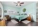 Cozy bedroom with a ceiling fan, plantation shutters, and an accent chair at 9390 W Louise Dr, Peoria, AZ 85383