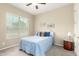 Cozy bedroom featuring a soft color palette, window, and a calming atmosphere at 9390 W Louise Dr, Peoria, AZ 85383
