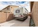 Extended driveway featuring a large RV, secured behind a gate; convenient parking for recreational vehicles at 9390 W Louise Dr, Peoria, AZ 85383
