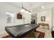 Bright game room featuring a pool table with overhead light fixture at 9390 W Louise Dr, Peoria, AZ 85383
