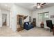 Bright living room with comfortable seating and a small office area, providing ample space at 9390 W Louise Dr, Peoria, AZ 85383