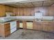 Traditional kitchen featuring wood cabinets, an oven range, and tiled ceiling at 9846 N 10Th St, Phoenix, AZ 85020