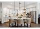 Bright kitchen boasts a large island with seating, stainless steel appliances, and ample cabinet space at 13450 E Via Linda St # 1019, Scottsdale, AZ 85259