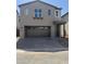 Two-story home with a two-car garage and a covered entryway at 2467 W Rowel Rd, Phoenix, AZ 85085