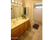 Bright bathroom with a single sink vanity and a shower-tub combo at 520 E Appaloosa Rd, Gilbert, AZ 85296