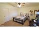 Bedroom featuring a comfortable bed, desk, and ample natural light, closet with sliding doors at 520 E Appaloosa Rd, Gilbert, AZ 85296