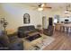 Spacious living room featuring hardwood floors, comfortable seating, ceiling fans and lots of natural light at 520 E Appaloosa Rd, Gilbert, AZ 85296