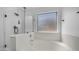 Bright bathroom featuring a soaking tub and glass-enclosed shower at 6092 S Bridal Vail Dr, Gilbert, AZ 85298