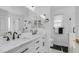 A bright bathroom features a double vanity with marble countertop and black hardware at 6092 S Bridal Vail Dr, Gilbert, AZ 85298