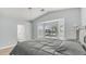 Spacious bedroom featuring vaulted ceilings, a bay window, and a large bed with soft, natural lighting at 6092 S Bridal Vail Dr, Gilbert, AZ 85298