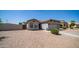 Single-story home featuring desert landscaping, a two-car garage, and a well-manicured front yard at 6092 S Bridal Vail Dr, Gilbert, AZ 85298