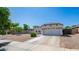 Charming single-story home with a well-maintained front yard, desert landscaping, and a two-car garage at 6092 S Bridal Vail Dr, Gilbert, AZ 85298
