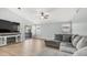 Living room includes access to a sliding glass door with a large gray sectional at 6092 S Bridal Vail Dr, Gilbert, AZ 85298