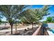 Neighborhood street with sidewalks, trees, and houses in the background at 6092 S Bridal Vail Dr, Gilbert, AZ 85298