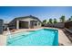 This backyard pool has bright blue water, brick accents, a backyard patio, and lounge chairs at 6092 S Bridal Vail Dr, Gilbert, AZ 85298