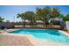 Backyard pool with brick trim, surrounding fence and backyard foliage at 6092 S Bridal Vail Dr, Gilbert, AZ 85298