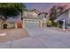 Charming two-story home featuring desert landscaping and a two car garage in a residential neighborhood at 18103 W Canyon Ln, Goodyear, AZ 85338