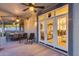 Covered patio with seating and lighting leading to interiors at 18103 W Canyon Ln, Goodyear, AZ 85338