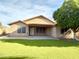 Well-maintained backyard with an artificial lawn and mature landscaping at 2453 E Nathan Way, Chandler, AZ 85225