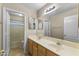 Bathroom features a double sink vanity, a full mirror, and a shower/tub combo at 2453 E Nathan Way, Chandler, AZ 85225