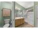 Bathroom features a double sink vanity and a shower with glass doors at 2453 E Nathan Way, Chandler, AZ 85225