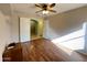 Inviting bedroom with wood flooring, interior access doors, closet and access to other rooms at 2453 E Nathan Way, Chandler, AZ 85225
