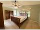Spacious bedroom featuring a ceiling fan, large window, and built-in bookcase at 2453 E Nathan Way, Chandler, AZ 85225