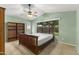 Bedroom with a ceiling fan and a window with a backyard view, and a bookcase for storage at 2453 E Nathan Way, Chandler, AZ 85225
