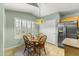 Cozy breakfast nook with a quaint table and a window with plantation shutters at 2453 E Nathan Way, Chandler, AZ 85225