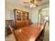 Elegant dining room with wood table and chairs, complemented by a vintage hutch at 2453 E Nathan Way, Chandler, AZ 85225