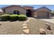 Charming single-story home with desert landscaping, stone walkway and a covered front porch at 2453 E Nathan Way, Chandler, AZ 85225
