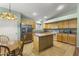 Bright kitchen featuring stainless steel appliances and a central island at 2453 E Nathan Way, Chandler, AZ 85225