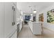 Modern white kitchen with stainless steel appliances and a center island at 312 E Windsor Ave # 5, Phoenix, AZ 85004