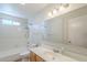 This bathroom features a tub/shower combo, tile floors, and a vanity with storage at 4621 E Mineral Rd, Phoenix, AZ 85044