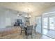 Open floor plan with dining area flowing into living room and patio access at 4621 E Mineral Rd, Phoenix, AZ 85044