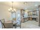 Charming dining area with a pendant light fixture and a view into the well-lit kitchen at 4621 E Mineral Rd, Phoenix, AZ 85044