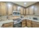 Kitchen featuring stainless steel appliances, granite counters and custom cabinets at 4621 E Mineral Rd, Phoenix, AZ 85044