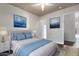 Comfortable bedroom featuring stylish decor, ceiling fan, and ample natural light at 567 E Bradstock Way, Queen Creek, AZ 85140