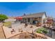 Expansive backyard with a beautiful water feature and outdoor kitchen area at 6110 E Ivyglen St, Mesa, AZ 85205