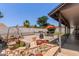 Relaxing backyard with outdoor kitchen and charming water feature at 6110 E Ivyglen St, Mesa, AZ 85205