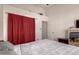 Cozy bedroom featuring a comfortable bed, neutral decor, and ample natural light at 6110 E Ivyglen St, Mesa, AZ 85205