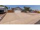 Spacious driveway leading to a two-car garage, plus secure RV parking with private gated fence at 6110 E Ivyglen St, Mesa, AZ 85205