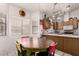 Eat-in kitchen featuring a wood dining table, oak cabinets, and stainless steel appliances at 6110 E Ivyglen St, Mesa, AZ 85205