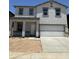 Charming two-story home featuring a two-car garage, neutral colors, and modern architectural details at 1998 E Bucking Bronco Dr, San Tan Valley, AZ 85140