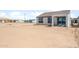 The backyard of this home is dirt, but has a covered patio, perfect for adding personal landscaping at 26992 W Melinda Ln, Buckeye, AZ 85396