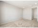 Neutral bedroom with plush carpeting, bright natural light, and a view to the backyard at 26992 W Melinda Ln, Buckeye, AZ 85396