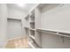 Spacious walk-in closet with ample shelving and storage, ready for organization at 26992 W Melinda Ln, Buckeye, AZ 85396