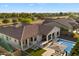 Aerial view of the property showcasing the backyard, pool, outdoor kitchen, and surrounding landscape at 3574 E Tonto Pl, Chandler, AZ 85249
